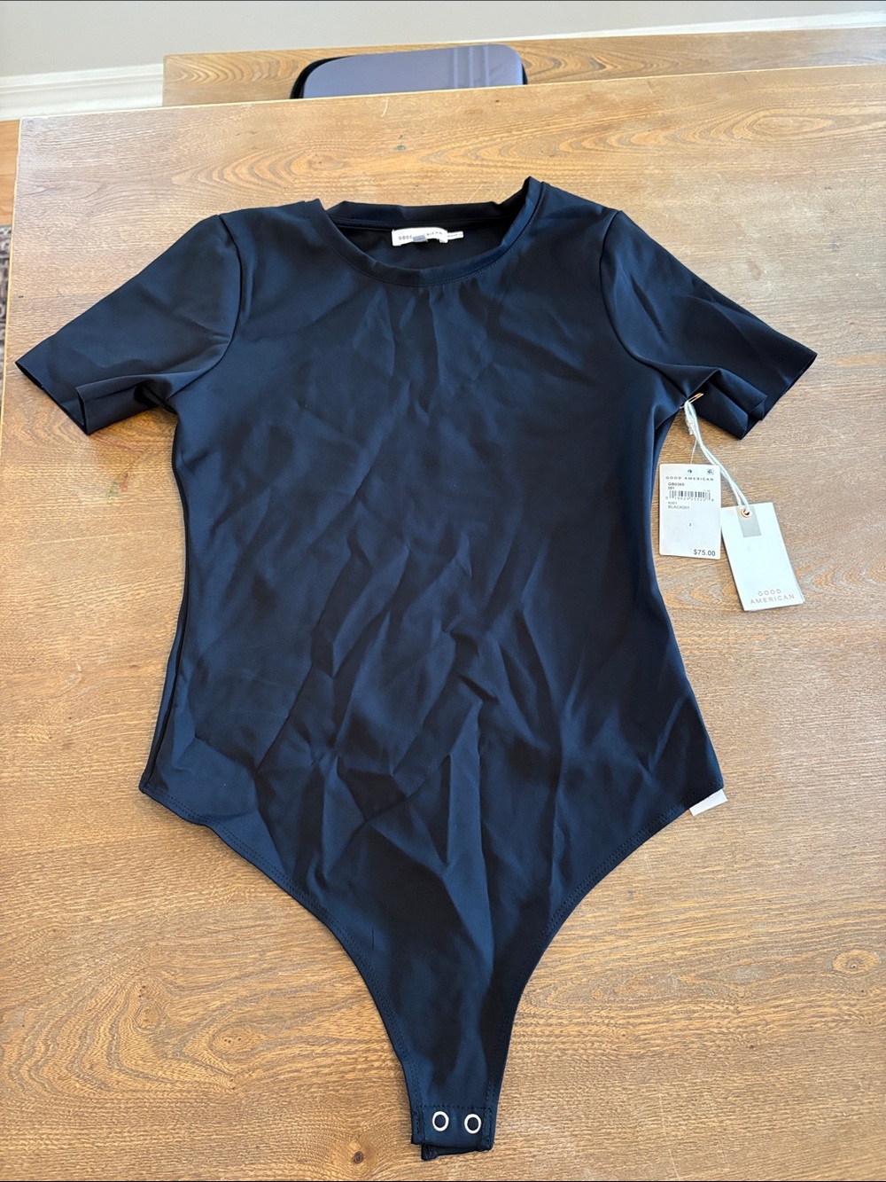 Good American Black Short Sleeve One-Piece Bodysuit